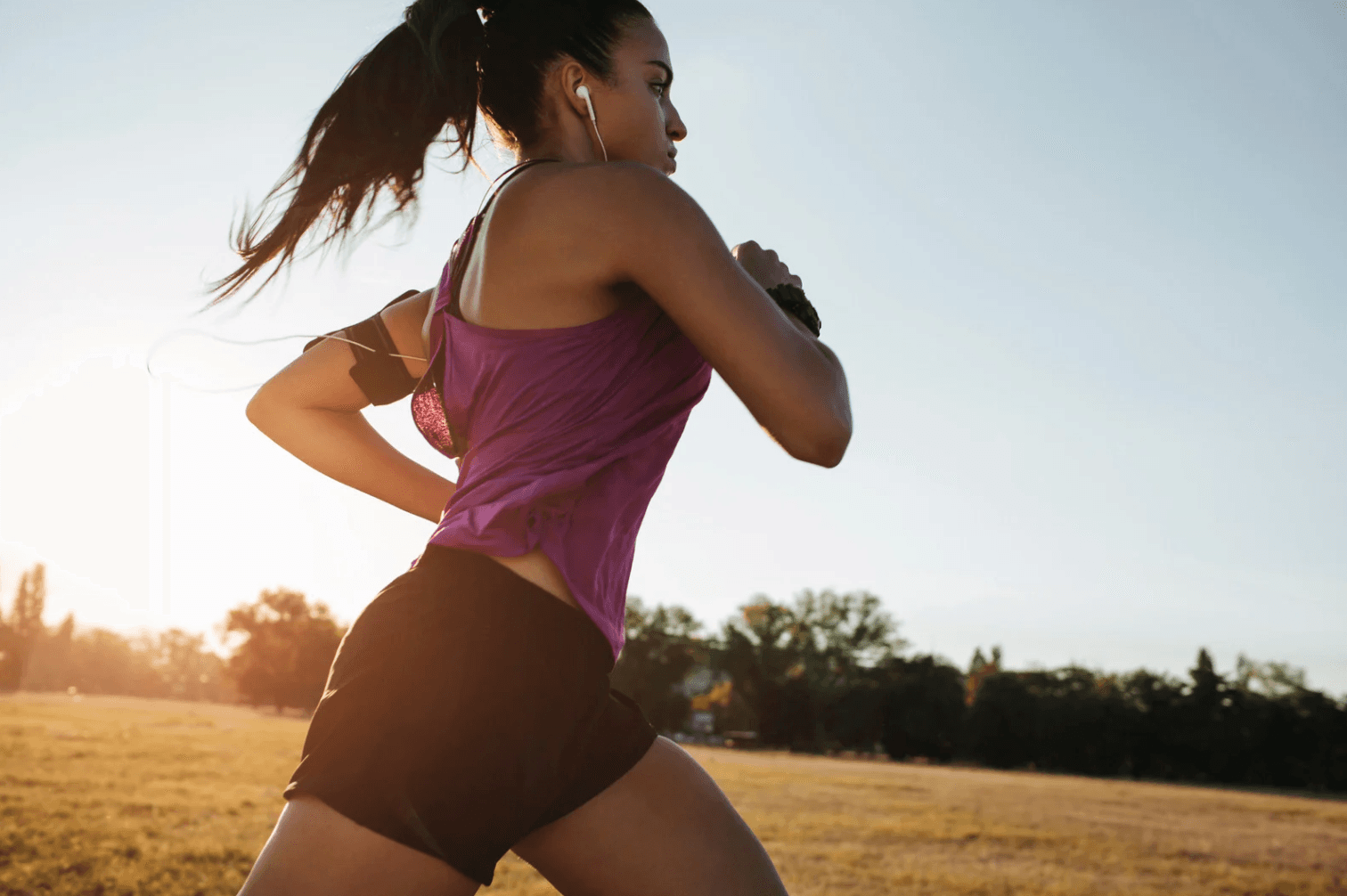 Woman running at sunset — strength in motion
